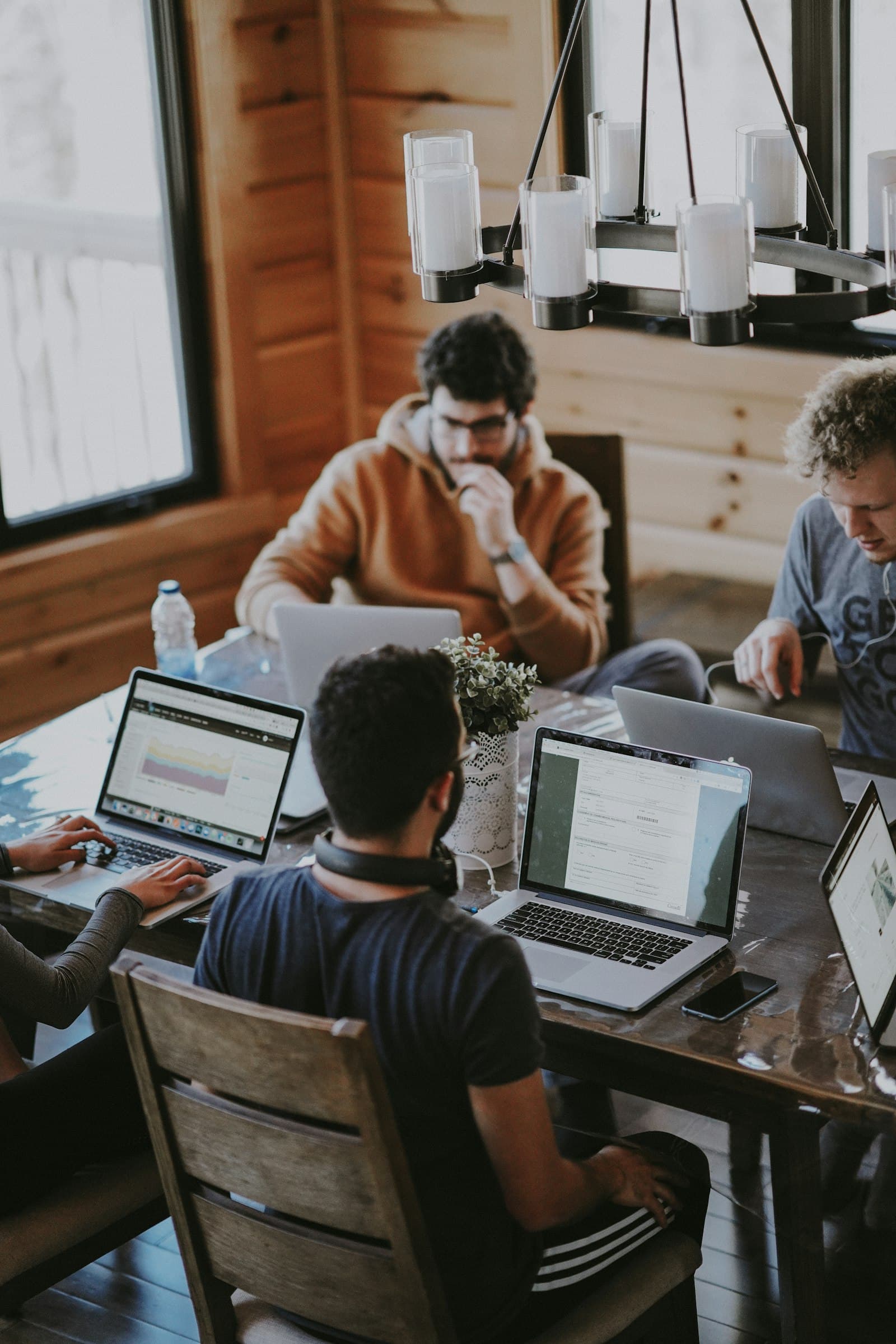 A Canberra-based product team in a working session — Aiinfox's senior Australian delivery for federal-government-adjacent, DSTG-adjacent defence research, and Crown corporation digital teams.
