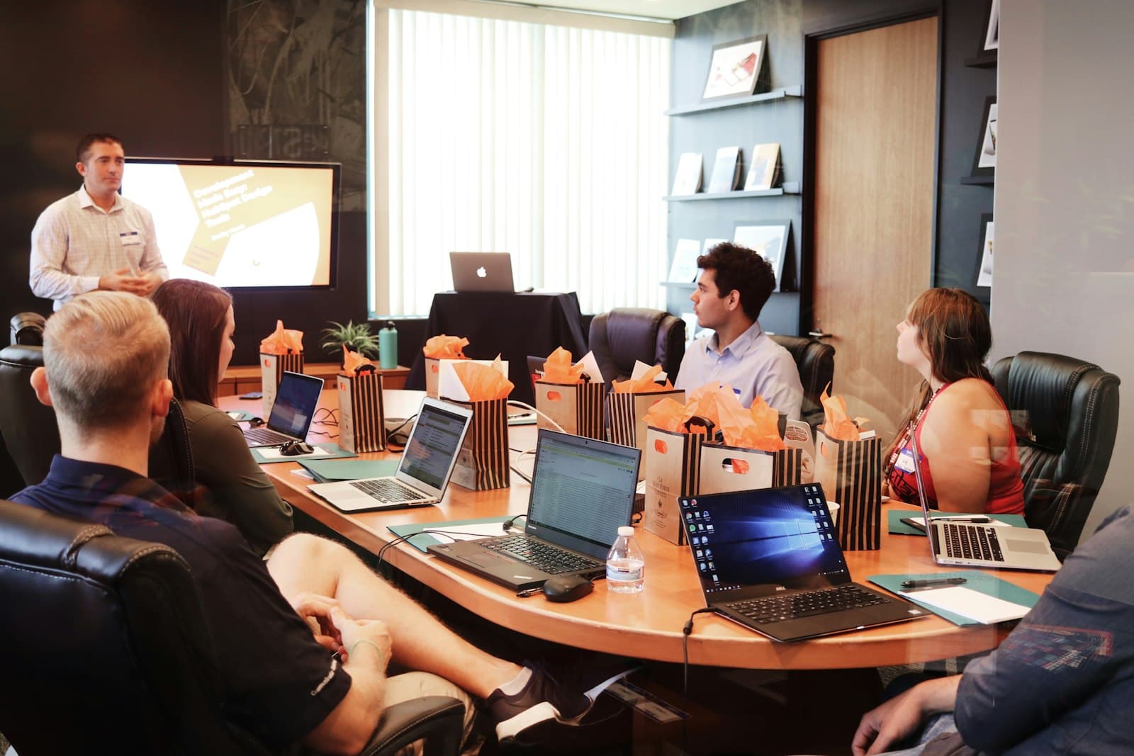 An Edmonton-based engineering team in a downtown office — Aiinfox's senior Canadian delivery for AMII-adjacent applied AI, Stantec-adjacent engineering, energy services, and Alberta Health Services-adjacent healthtech.