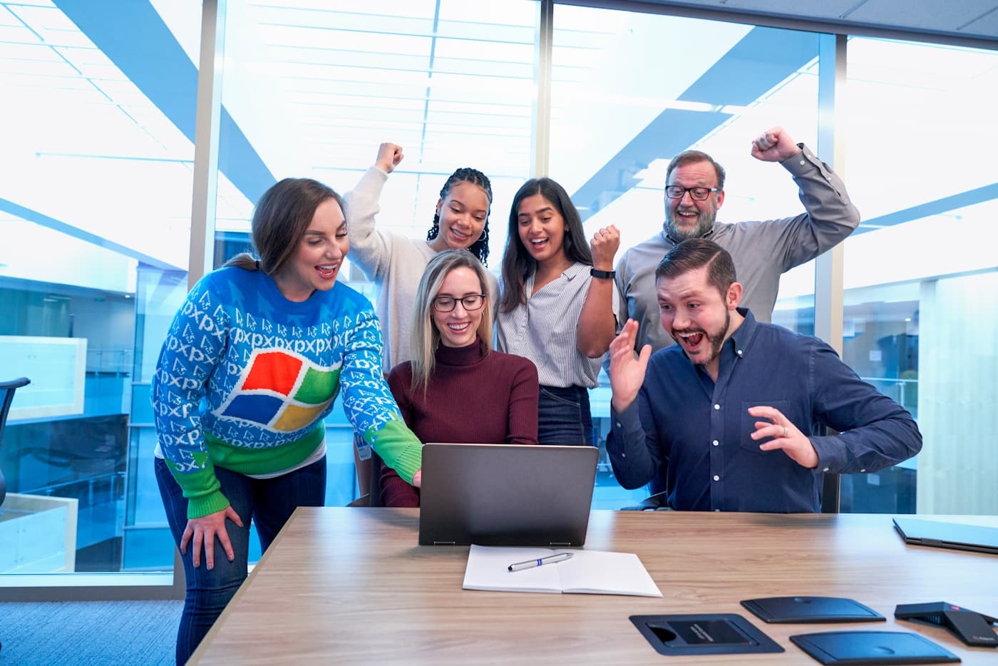 A diverse Canadian engineering team around a laptop — representing the senior PIPEDA + Quebec Law 25-aligned AI work Aiinfox ships for Toronto, Montreal, Vancouver and Calgary clients.